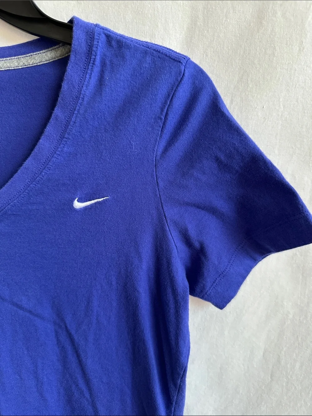 Nike blue V-neck athletic T-shirt with a white embroidered swoosh logo - Picture 3 of 7